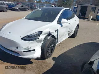2021 Tesla Model Y Long Range with VIN 5YJYGDEE8MF125104, listed as a IAAI auction lot 41698065 with 25,177 mi miles and . Bid and sale history available at DreamBid. Image 6.
