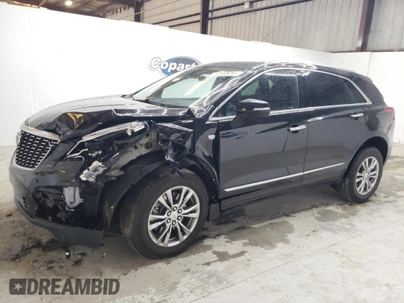 2023 Cadillac XT5 FWD Premium Luxury with VIN 1GYKNCRS6PZ171335, listed as a Copart auction lot 51859385 with 52,691 mi miles and Clean Title. Bid and sale history available at carsss.com. Image 1.