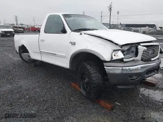 2003 Ford F-150 Standard with VIN 1FTRF18L13NA97520, listed as a IAAI auction lot 40909036 with NaN miles. Bid and sale history available at carsss.com. Image 1.
