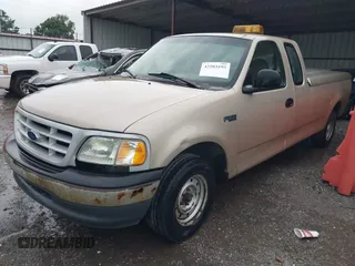 1999 Ford F-150 z VIN 1FTZX1727XNC32012, wystawiony jako IAAI lot #42503195 z przebiegiem 1 805 469 mil mil oraz . Historia ofert i sprzedaży dostępna na DreamBid. Obrazek 2.