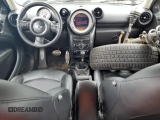 2014 MINI Countryman S with VIN WMWZC5C58EWP39797, listed as a Copart auction lot 62193515 with 84,989 mi miles and Salvage title. Bid and sale history available at DreamBid. Image 8.