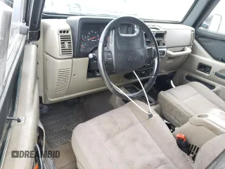 2003 Jeep Wrangler Sport with VIN 1J4FA49S03P330858, listed as a Copart auction lot 59519085 with Not provided miles and Salvage title. Bid and sale history available at DreamBid. Image 8.