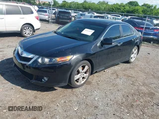 2009 Acura TSX with VIN JH4CU26659C011482, listed as a IAAI auction lot 42212079 with 243,119 mi miles. Bid and sale history available at carsss.com. Image 2.