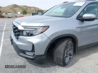 2023 Honda Passport EX-L with VIN 5FNYF8H53PB034963, listed as a IAAI auction lot 41686154 with 12,572 mi miles and . Bid and sale history available at carsss.com. Image 6.