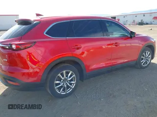 2016 Mazda CX-9 Touring z VIN JM3TCACY9G0122174, wystawiony jako IAAI lot #42613740 z przebiegiem 148 646 mil mil oraz . Historia ofert i sprzedaży dostępna na DreamBid. Obrazek 4.