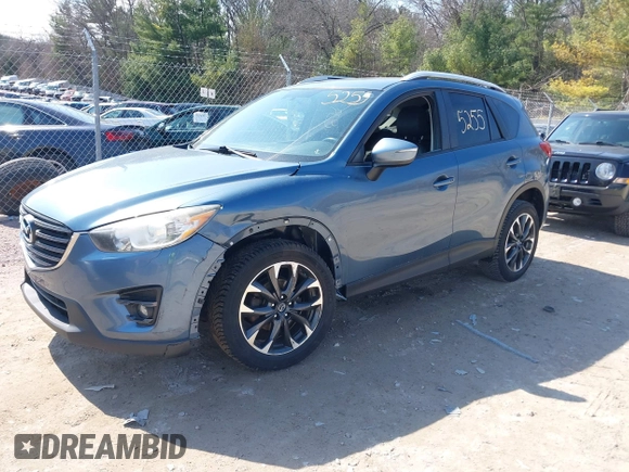 2016 Mazda CX-5 Grand Touring z VIN JM3KE4DY6G0785255, wystawiony jako IAAI lot #41887066 z przebiegiem 171 334 mil mil oraz . Historia ofert i sprzedaży dostępna na DreamBid. Obrazek 22.