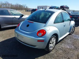 2010 Volkswagen New Beetle Coupe with VIN 3VWRW3AG2AM018644, listed as a IAAI auction lot 41815380 with 99,738 mi miles. Bid and sale history available at carsss.com. Image 4.