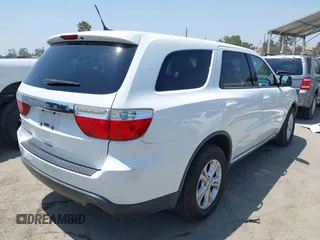 2013 Dodge Durango SXT with VIN 1C4RDHAG0DC669587, listed as a IAAI auction lot 42599143 with 126,748 mi miles and . Bid and sale history available at DreamBid. Image 4.