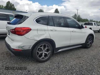 2018 BMW X1 xDrive28i with VIN WBXHT3C35J5L29298, listed as a Copart auction lot 59041435 with 27,612 mi miles and Salvage title. Bid and sale history available at DreamBid. Image 3.