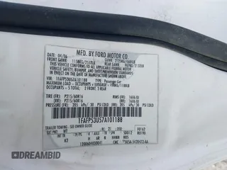 2007 Ford Taurus SE z VIN 1FAFP53U57A101188, wystawiony jako IAAI lot #42102585 z przebiegiem Nie podano mil oraz . Historia ofert i sprzedaży dostępna na DreamBid. Obrazek 9.
