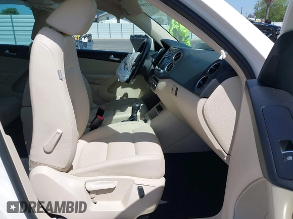 2014 Volkswagen Tiguan SEL with VIN WVGAV3AX9EW512956, listed as a IAAI auction lot 42110002 with 136,034 mi miles and . Bid and sale history available at DreamBid. Image 5.