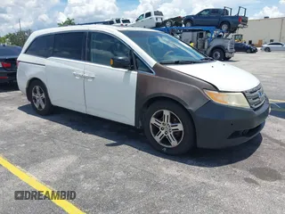 2011 Honda Odyssey Touring with VIN 5FNRL5H98BB051023, listed as a IAAI auction lot 42810697 with Not provided miles and . Bid and sale history available at DreamBid. Image 1.