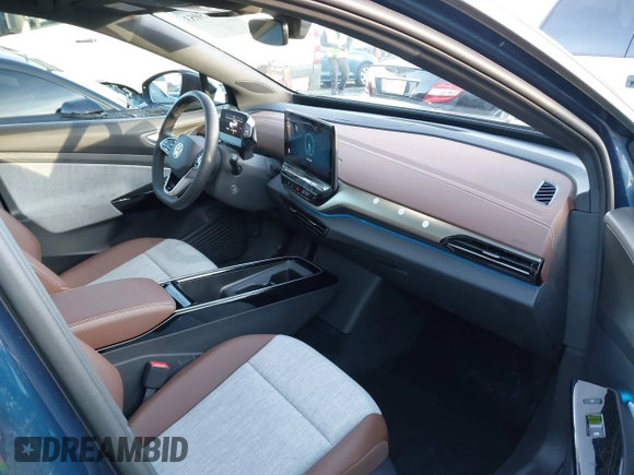 2023 Volkswagen ID.4 Pro z VIN 1V2DNPE81PC017620, wystawiony jako IAAI lot #41573053 z przebiegiem 15 462 mil mil oraz . Historia ofert i sprzedaży dostępna na DreamBid. Obrazek 5.