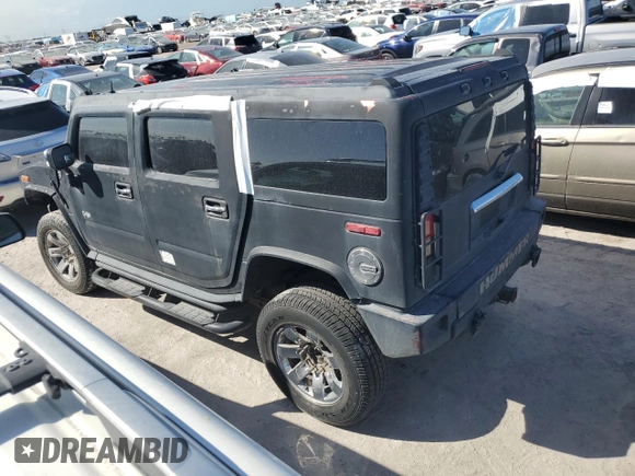 2003 Hummer H2 with VIN 5GRGN23U13H143781, listed as a Copart auction lot 77833264 with 0 mi miles and Salvage Title. Bid and sale history available at carsss.com. Image 2.