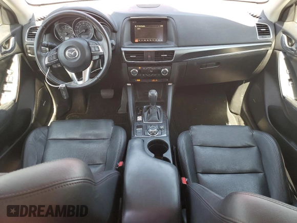 2016 Mazda CX-5 Grand Touring z VIN JM3KE2DYXG0840777, wystawiony jako Copart lot #49700585 z przebiegiem 116 469 mil mil oraz Szkoda całkowita • Salvage title. Historia ofert i sprzedaży dostępna na DreamBid. Obrazek 8.