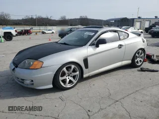 2003 Hyundai Tiburon GT z VIN KMHHN65F13U102985, wystawiony jako Copart lot #45294325 z przebiegiem 326 919 mil mil oraz Szkoda całkowita • Salvage title. Historia ofert i sprzedaży dostępna na DreamBid. Obrazek 1.