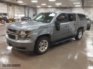2019 Chevrolet Suburban LT with VIN 1GNSKHKC3KR195042, listed as a IAAI auction lot 41704591 with 107,166 mi miles. Bid and sale history available at carsss.com. Image 2.