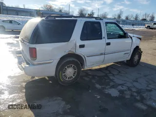 2000 GMC Envoy z VIN 1GKDT13W4Y2348984, wystawiony jako Copart lot #89062865 z przebiegiem 159 592 mil mil oraz Szkody całkowita. Historia ofert i sprzedaży dostępna na DreamBid. Obrazek 3.