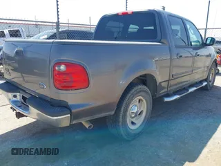 2003 Ford F-150 XLT with VIN 1FTRW07L63KA65904, listed as a IAAI auction lot 41983556 with 166,086 mi miles. Bid and sale history available at carsss.com. Image 4.