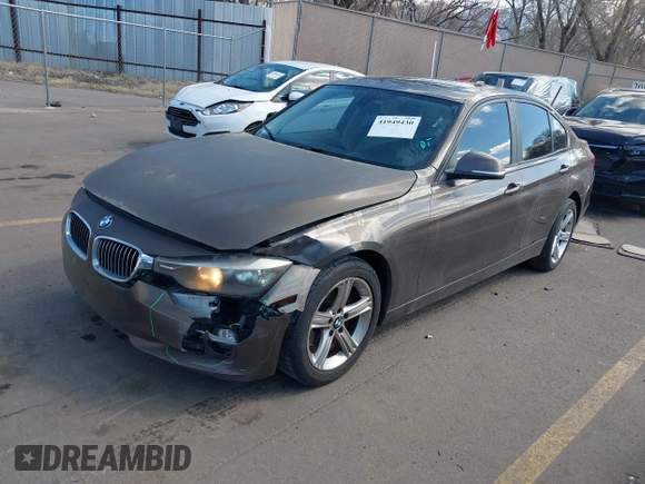 2014 BMW 3 Series 320i xDrive with VIN WBA3C3C58EF983816, listed as a IAAI auction lot 41949430 with 111,627 mi miles. Bid and sale history available at carsss.com. Image 2.