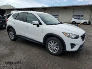 2016 Mazda CX-5 Touring with VIN JM3KE4CY7G0821701, listed as a Copart auction lot 43805495 with 144,416 mi miles and Salvage Title. Bid and sale history available at carsss.com. Image 4.