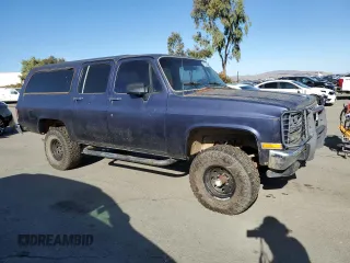 1991 GMC Suburban z VIN 1GKEV16K9MF510909, wystawiony jako Copart lot #81326004 z przebiegiem 216 778 mil mil oraz Tytuł czysty. Historia ofert i sprzedaży dostępna na DreamBid. Obrazek 4.