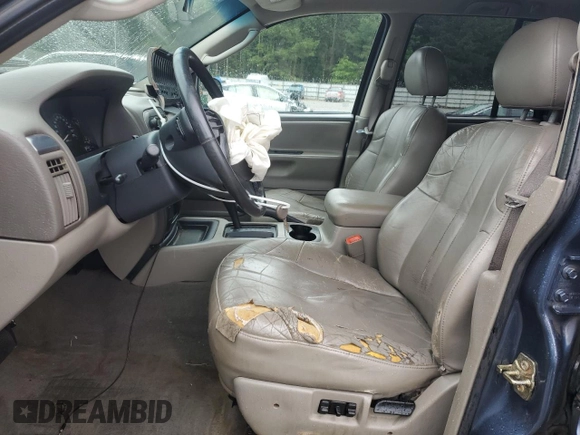 2004 Jeep Grand Cherokee Laredo with VIN 1J4GX48SX4C201569, listed as a Copart auction lot 58631585 with 271,124 mi miles and Salvage title. Bid and sale history available at DreamBid. Image 7.