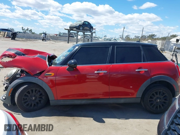 2017 MINI Hardtop 4 Door Cooper z VIN WMWXU1C57H2E18670, wystawiony jako IAAI lot #41950314 z przebiegiem 94 199 mil mil oraz . Historia ofert i sprzedaży dostępna na DreamBid. Obrazek 15.