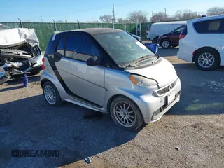 2013 Smart fortwo Pure with VIN WMEEJ3BA7DK614923, listed as a IAAI auction lot 41677011 with 63,866 mi miles. Bid and sale history available at carsss.com. Image 1.