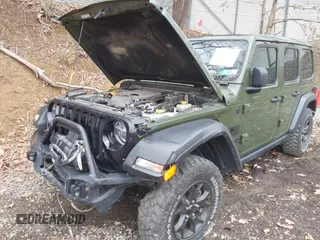 2021 Jeep Wrangler Unlimited Willys with VIN 1C4HJXDNXMW579595, listed as a IAAI auction lot 41930989 with 32,148 mi miles and . Bid and sale history available at DreamBid. Image 6.