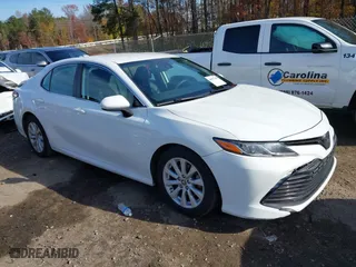 2020 Toyota Camry LE with VIN 4T1C11AKXLU986310, listed as a IAAI auction lot 40977100 with 108,208 mi miles. Bid and sale history available at carsss.com. Image 1.