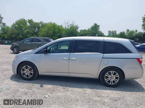 2012 Honda Odyssey EX z VIN 5FNRL5H44CB038825, wystawiony jako IAAI lot #42411401 z przebiegiem 214 164 mil mil oraz . Historia ofert i sprzedaży dostępna na DreamBid. Obrazek 14.