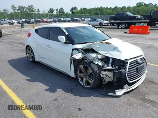 2013 Hyundai Veloster Turbo z VIN KMHTC6AE6DU112233, wystawiony jako IAAI lot #42295962 z przebiegiem 151 091 mil mil oraz . Historia ofert i sprzedaży dostępna na DreamBid. Obrazek 1.
