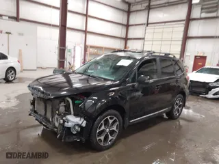 2015 Subaru Forester 2.0XT Touring with VIN JF2SJGUC9FH548304, listed as a IAAI auction lot 41728543 with 114,450 mi miles. Bid and sale history available at carsss.com. Image 2.