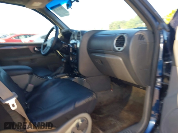 2003 GMC Envoy SLT z VIN 1GKET16S736233956, wystawiony jako IAAI lot #41844351 z przebiegiem 244 942 mil mil oraz . Historia ofert i sprzedaży dostępna na DreamBid. Obrazek 5.