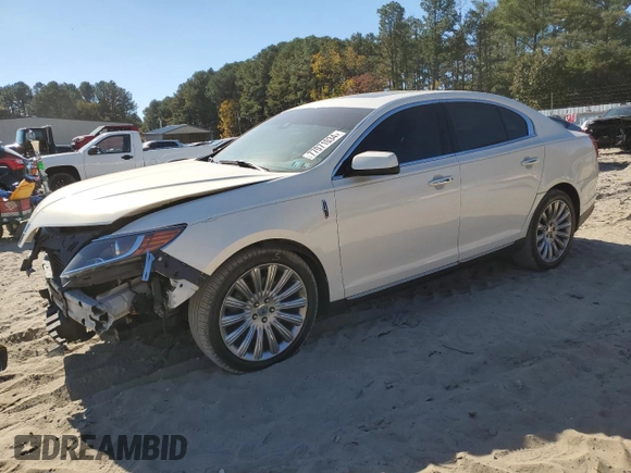2013 Lincoln MKS z VIN 1LNHL9DK0DG605400, wystawiony jako Copart lot #77071034 z przebiegiem 73 450 mil mil oraz Szkoda całkowita • Salvage title. Historia ofert i sprzedaży dostępna na DreamBid. Obrazek 1.
