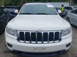 2011 Jeep Grand Cherokee Laredo with VIN 1J4RR4GG0BC670506, listed as a IAAI auction lot 42462778 with 241,406 mi miles and . Bid and sale history available at DreamBid. Image 6.