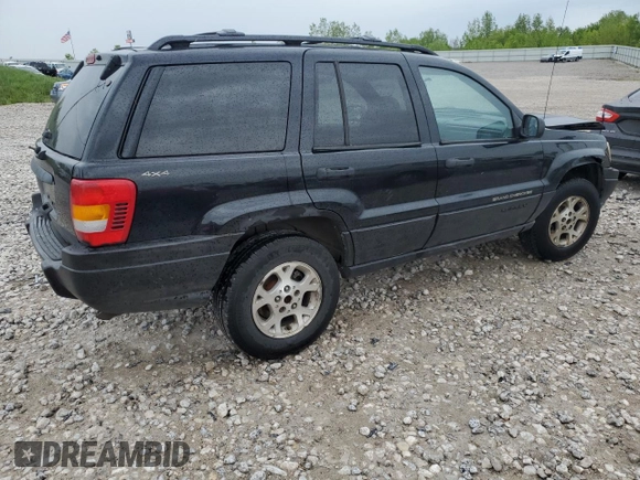 2000 Jeep Grand Cherokee Laredo z VIN 1J4GW48S1YC326453, wystawiony jako Copart lot #57332675 z przebiegiem 290 059 mil mil oraz Czysty tytuł • Clean title. Historia ofert i sprzedaży dostępna na DreamBid. Obrazek 3.