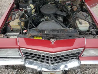 1991 Cadillac Brougham z VIN 1G6DW5474MR703030, wystawiony jako Copart lot #64687894 z przebiegiem 161 866 mil mil oraz Szkody całkowita. Historia ofert i sprzedaży dostępna na DreamBid. Obrazek 13.