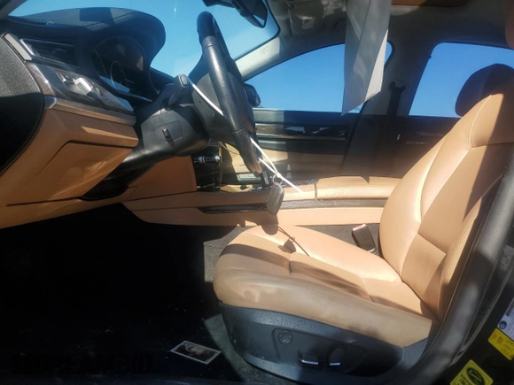 2012 BMW 7 Series 740i with VIN WBAKA4C52CDS99036, listed as a Copart auction lot 88492615 with Not provided miles and Salvage title. Bid and sale history available at DreamBid. Image 7.