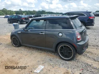 2012 MINI Hardtop S with VIN WMWSV3C50CTY18637, listed as a Copart auction lot 57771015 with 103,402 mi miles and Salvage title. Bid and sale history available at DreamBid. Image 2.