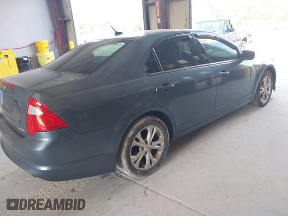 2012 Ford Fusion SE z VIN 3FAHP0HG6CR170633, wystawiony jako IAAI lot #42770990 z przebiegiem 233 383 mil mil oraz . Historia ofert i sprzedaży dostępna na DreamBid. Obrazek 4.