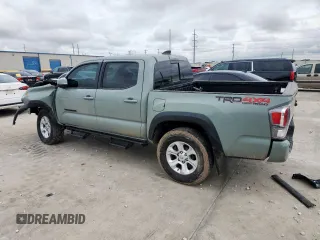 2023 Toyota Tacoma SR with VIN 3TMCZ5AN2PM580515, listed as a Copart auction lot 60422635 with 65,846 mi miles and Salvage title. Bid and sale history available at DreamBid. Image 2.
