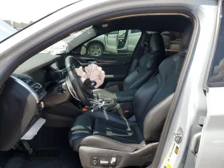 2022 BMW X4 M z VIN 5YM23EC02N9K87490, wystawiony jako Copart lot #65907114 z przebiegiem 55 555 mil mil oraz Szkoda całkowita • Salvage title. Historia ofert i sprzedaży dostępna na DreamBid. Obrazek 7.