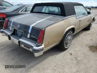 1985 Cadillac Eldorado z VIN 1G6EL578XFE614641, wystawiony jako Copart lot #75663984 z przebiegiem 54 128 mil mil oraz Szkody całkowita. Historia ofert i sprzedaży dostępna na DreamBid. Obrazek 3.