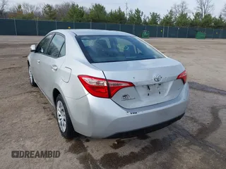 2019 Toyota Corolla L with VIN 5YFBURHE2KP934042, listed as a IAAI auction lot 41963491 with 87,299 mi miles. Bid and sale history available at carsss.com. Image 3.
