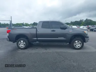 2012 Toyota Tundra z VIN 5TFUW5F10CX265994, wystawiony jako IAAI lot #42172968 z przebiegiem 197 493 mil mil oraz . Historia ofert i sprzedaży dostępna na DreamBid. Obrazek 13.