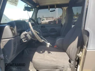 2003 Jeep Wrangler Sport z VIN 1J4FA49S43P327283, wystawiony jako Copart lot #59036295 z przebiegiem 158 108 mil mil oraz Szkoda całkowita • Salvage title. Historia ofert i sprzedaży dostępna na DreamBid. Obrazek 7.