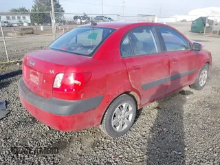 2009 Kia Rio LX with VIN KNADE223796485606, listed as a IAAI auction lot 41676881 with 58,852 mi miles and . Bid and sale history available at DreamBid. Image 4.