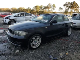 2010 BMW 1 Series 128i with VIN WBAUP9C5XAVL89207, listed as a Copart auction lot 80018904 with 124,842 mi miles and Salvage Title. Bid and sale history available at carsss.com. Image 1.
